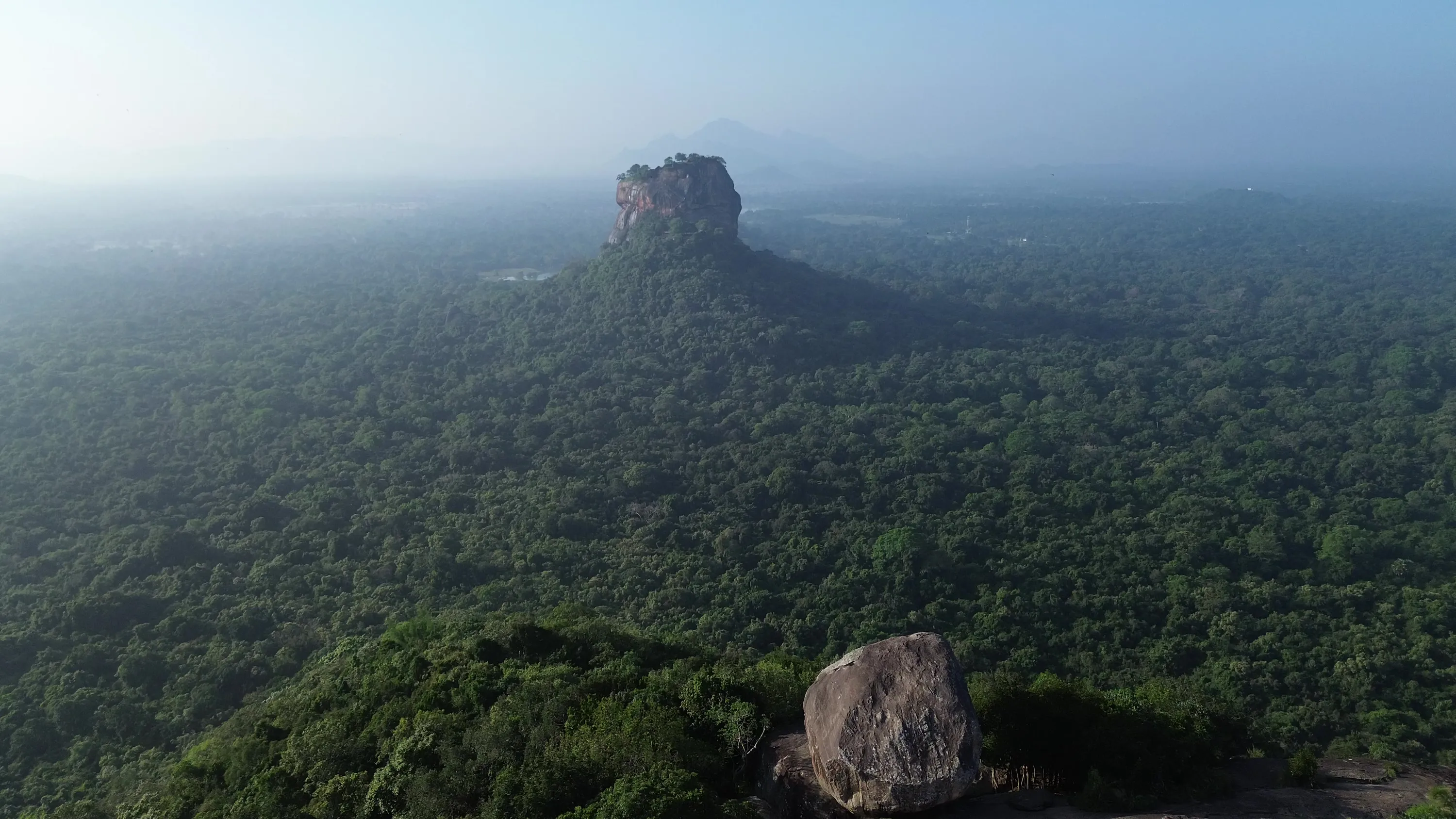 Sigiriya rock rising out of the jungle, seen at dawn from the top of Pidurangala