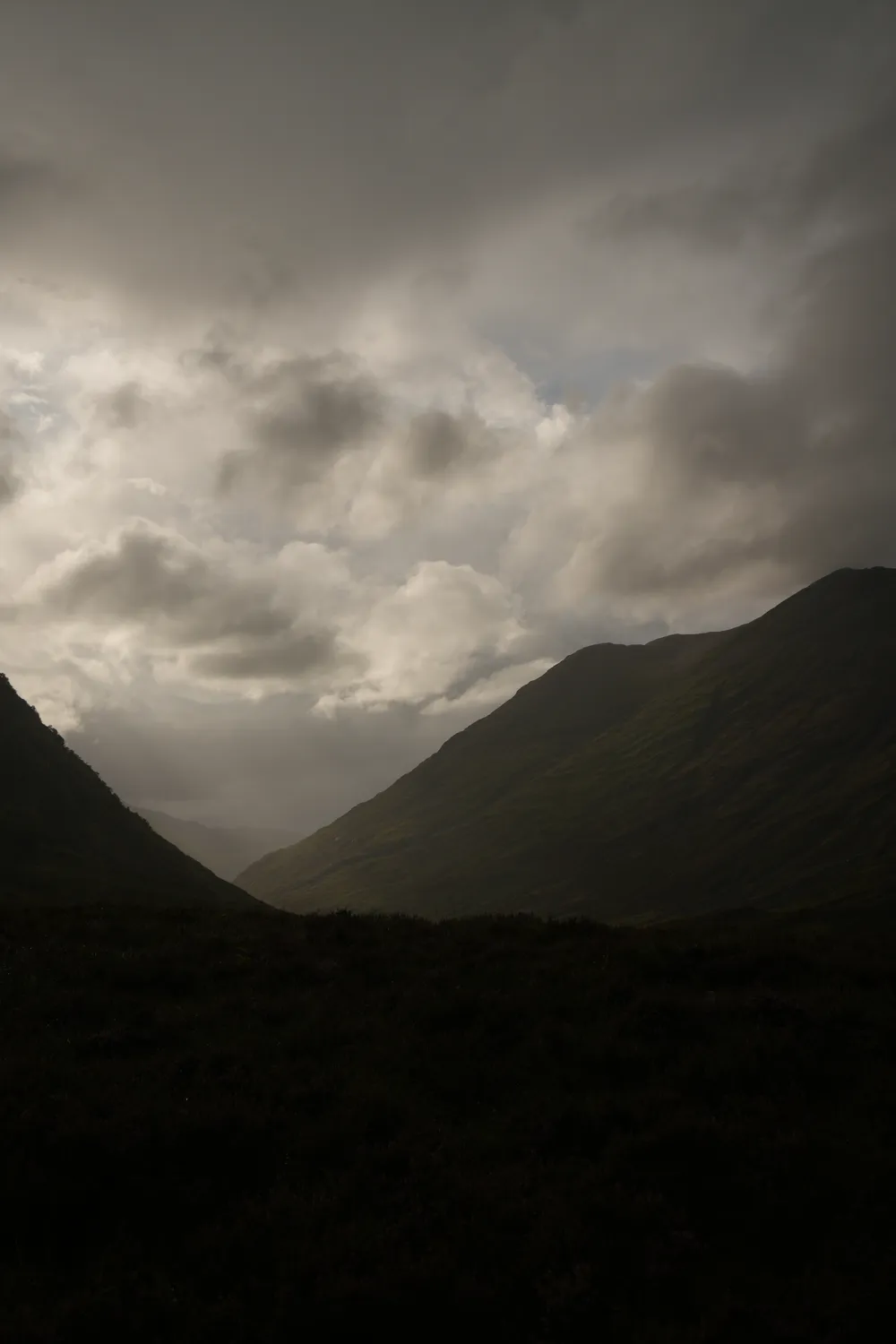 Hooded hiker on the Quiraing